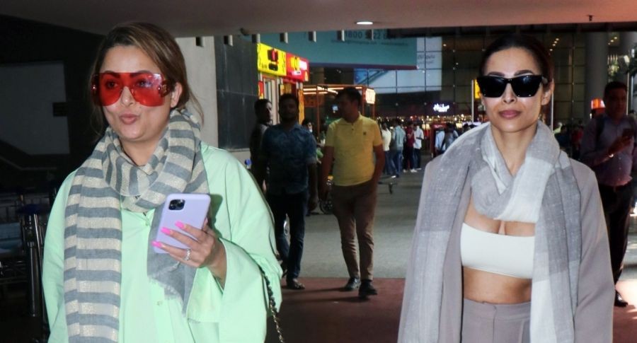 Mumbai: Bollywood actresses Malaika Arora and Amrita Arora spotted at the airport in Mumbai on Wednesday, December 21, 2022. (Photo: Sanjay Tiwari/IANS)