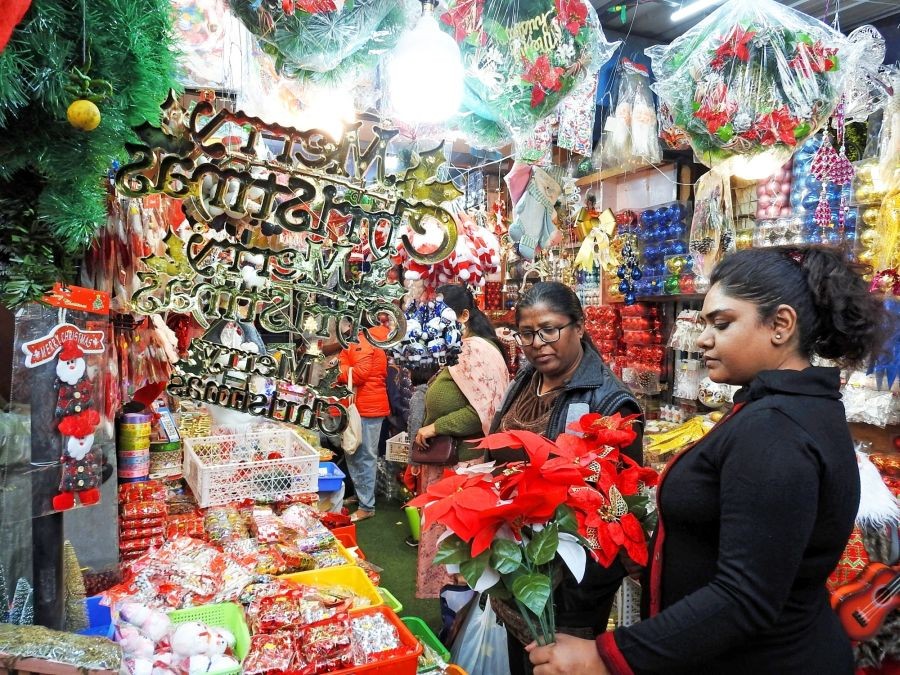 New Delhi: People buy decorative items from a shop ahead of Christmas, at INA Market in New Delhi on Monday December 19, 2022. (Photo: Anupam Gautam/IANS)