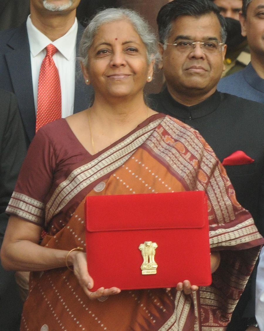 New Delhi : Finance Minister Nirmala Sitharaman, center, shows annual federal budget for the year 2022-23,with her team before leaving finance ministry for the parliament house to present it, in New Delhi, on Tuesday, Feb. 1, 2022 .(Photo:Biplab Banerjee/IANS)