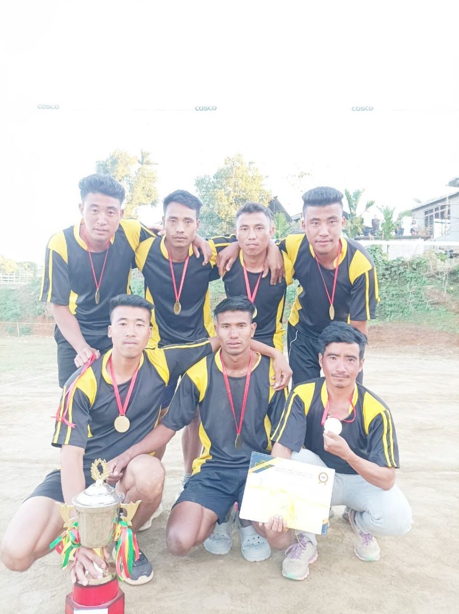 The champions Azailong with the trophy after the prize distribution on January 13 at Old Jalukie village Sector C.
