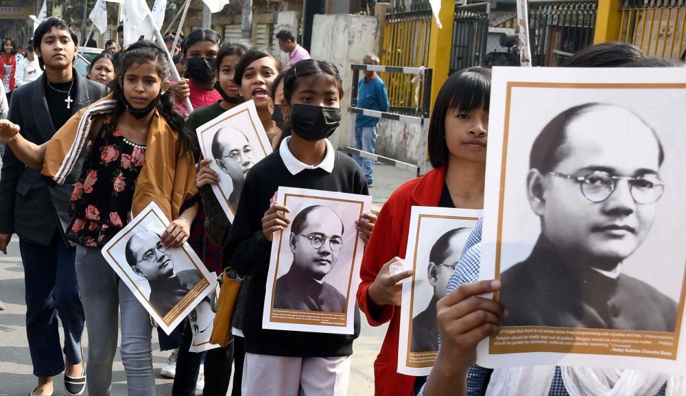 Guwahati:Students hold portraits of Netaji Subhash Chandra Bose as they take part a rally to mark 126th Birth Anniversary of Netaji Subhash Chandra Bose in Guwahati on Monday, 23 January 2023.(Photo: Anuwar hazarika/IANS)