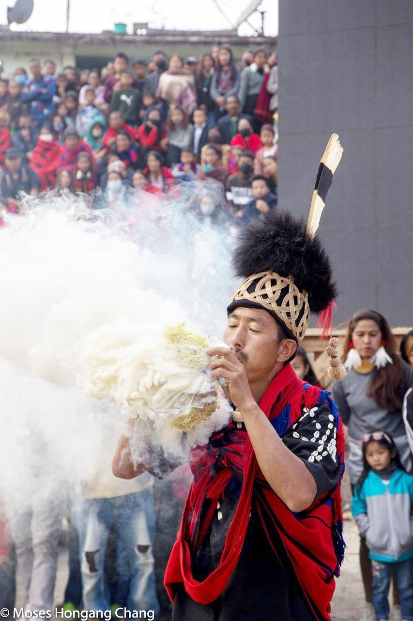 A man in traditional attire participating in the traditional fire making competition at the Poanglum festival at Parade Ground in Tuensang. (Photo by Moses Hongang Chang)