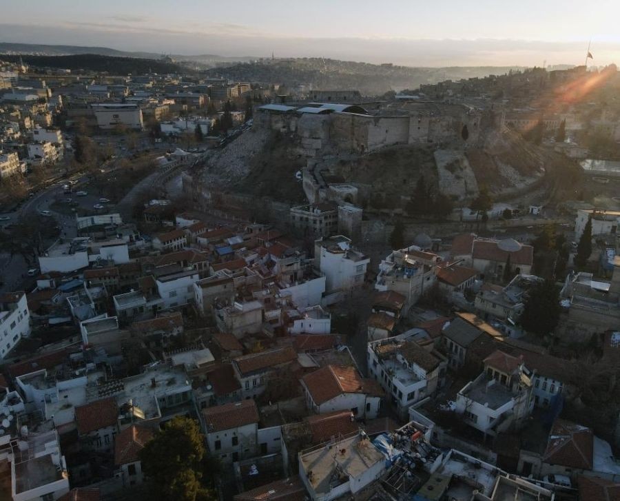 The aerial photo taken on Feb. 10, 2023 shows Gaziantep Castle damaged in the devastating earthquakes in Gaziantep, Turkey. The catastrophic earthquakes that rocked Turkey and Syria on Monday did not only lead to huge human casualties but also heavily damaged the cultural memory of a region famous for its rich history. Many ancient heritage sites have been destroyed in the disaster. Among them is the Roman-era Gaziantep Castle, a 2,000-year-old monument that used to be a prized cultural and tourist landmark of Gaziantep city. (Photo by Mustafa Kaya/Xinhua)