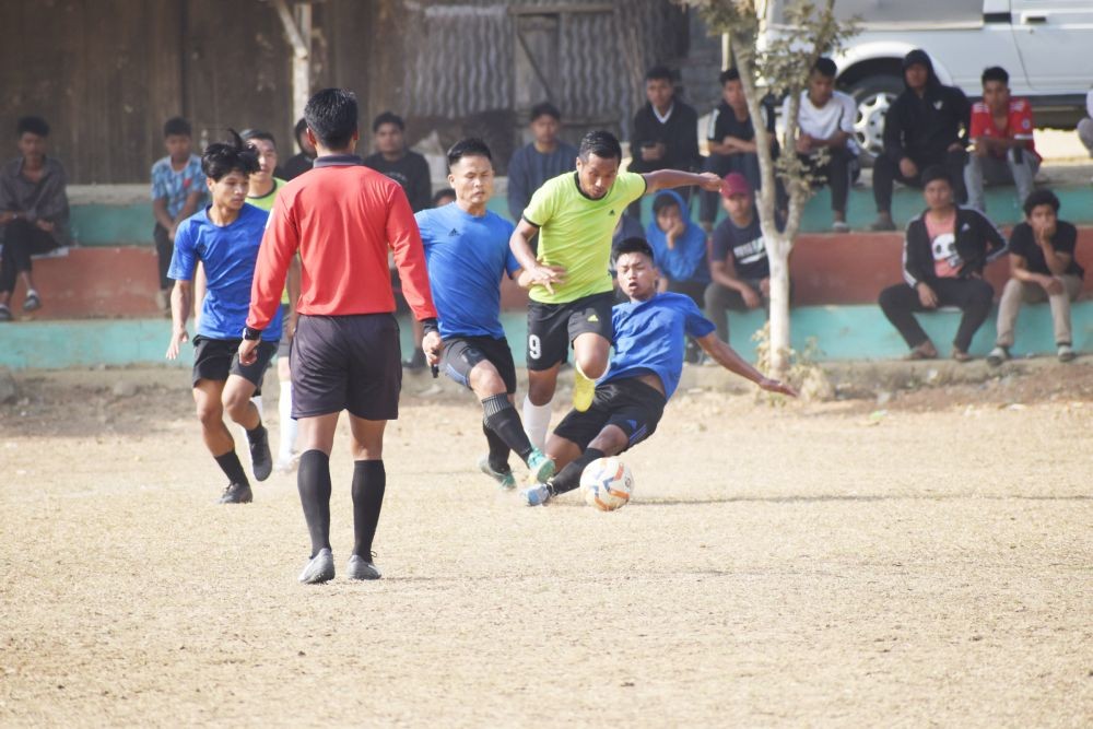 In the picture, Kekhrie of Amigos (neon) in action against Sirhima FC (blue)
