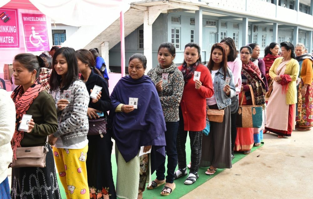 Shillong: Voters wait in a queue to cast their votes during Meghalaya Assembly elections in Shillong on Feb 27, 2018. A total of 18,09,818 electorates, including 9,13,702 women and 89,405 first-time voters are eligible to exercise their franchise to decide the fate of 361 candidates, including 31 women and many independents. (Photo: IANS/PIB)
