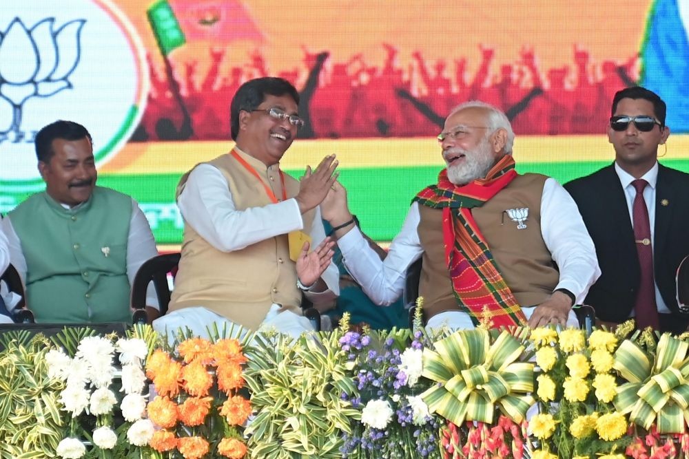 Agartala: Prime Minister Narendra Modi in a conversation with Tripura Chief Minister Manik Saha during an election campaign rally ahead of the Tripura Assembly elections in Agartala on Monday, Feb. 13, 2023. (Photo: Abhisek Saha/IANS)