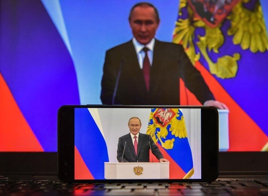 Photo taken on Sept. 30, 2022 shows screens displaying Russian President Vladimir Putin delivering a speech in Moscow, Russia. (Xinhua/Cao Yang/IANS)
