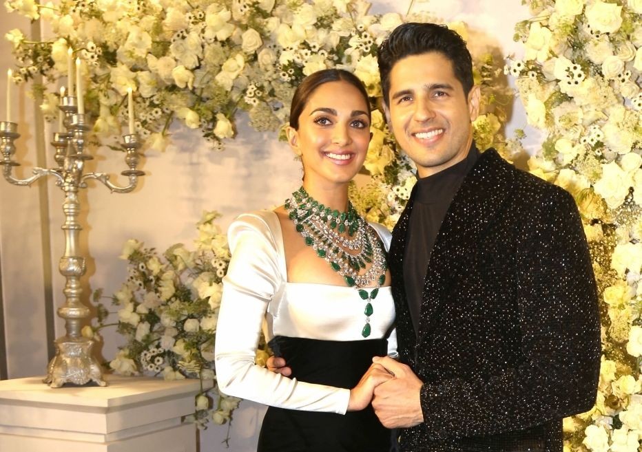 Mumbai:Bollywood Actors Sidharth Malhotra and Kiara Advani pose for photographs  during their wedding reception party in Mumbai on Sunday night.(Photo: Sanjay Tiwari/IANS)