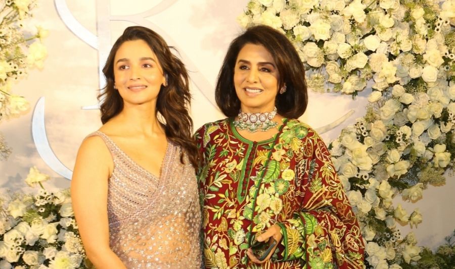 Mumbai:Bollywood Actresses Alia Bhatt and Neetu Kapoor pose for photographs during wedding reception of actors Sidharth Malhotra and Kiara Advani in Mumbai on Sunday night.(Photo: Sanjay Tiwari/IANS)