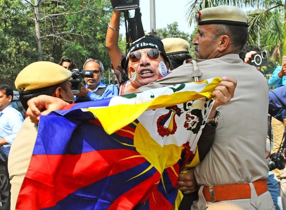 New Delhi: Delhi police personnel detain a member of Tibetan Youth Congress during their protest against China commemorating the 64th Tibetan National Uprising Day, outside Chinese embassy in New Delhi on Friday, March 10, 2023. (Photo: Qamar Sibtain/IANS)