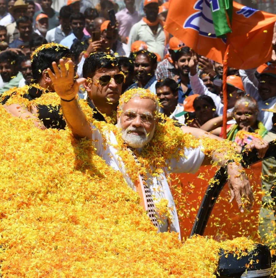 Mandya: Prime Minister Narendra Modi receives warm welcome from locals and supporters during a roadshow in Mandya on Sunday, March 12, 2023. (Photo: PIB/IANS)