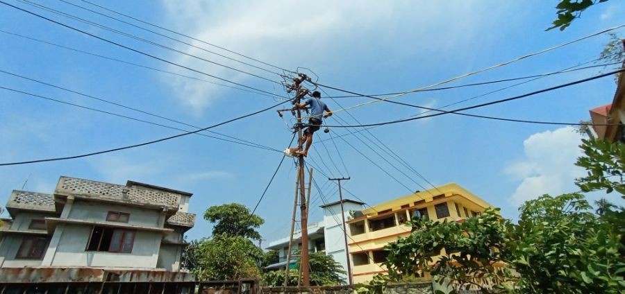 A power department employee is seen doing repair atop pole in Dimapur. (Morung File Photo)