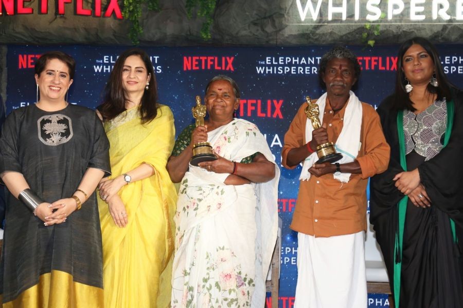 Mumbai: Oscar winner The Elephant Whisperer's director Kartiki Gonsalves and producer Guneet Monga with the caretaker of the elephant Bomman and Bellie during a press conference, in Mumbai on Thursday, March 23, 2023. (Photo: Sanjay Tiwari/IANS)