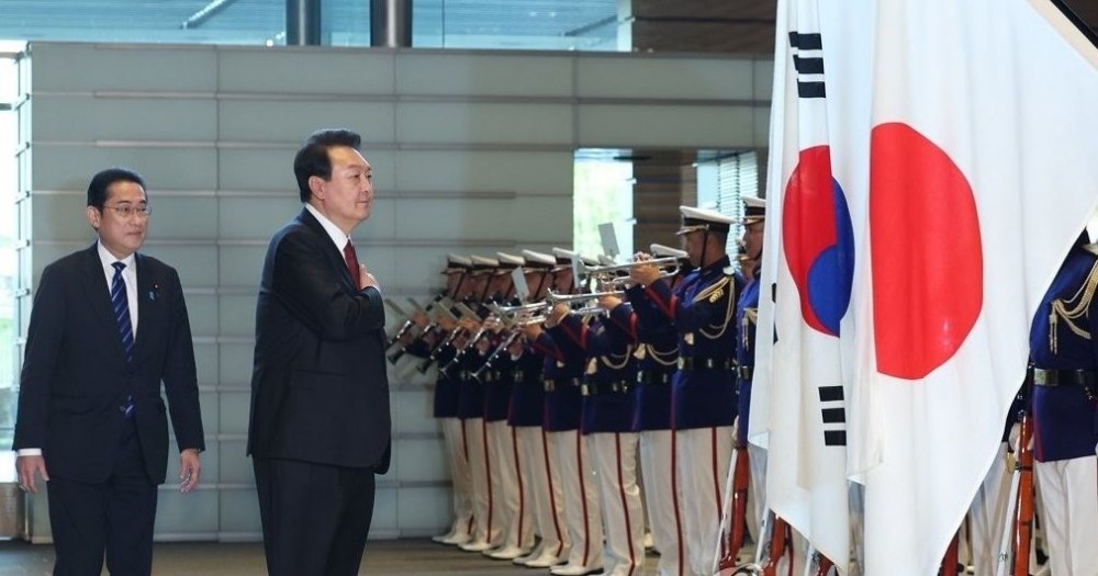 Seoul : South Korean President Yoon Suk Yeol (R) salutes the national flag during an honor guard inspection prior to summit talks with Japanese Prime Minister Fumio Kishida at the latter's residence in Tokyo on March 16, 2023. Yoon began a two-day trip to Japan to put strained relations back on track. The summit marks the first time in 12 years that such talks have taken place amid tense relations between the two nations. (Yonhap)IANS Photo