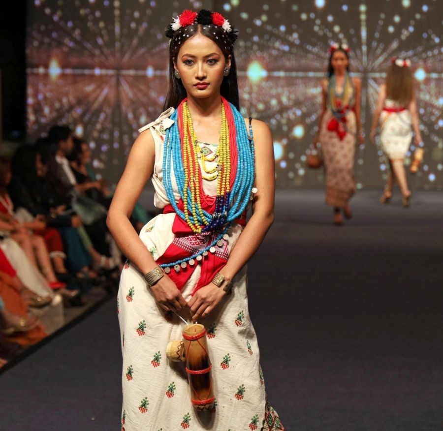 Guwahati: A model walks on a ramp during 'Vastra' fashion show organised by North East Institute of Fashion Technology (NEIFT), in Guwahati, Sunday night, March 26, 2023. (Photo: Anuwar hazarika/IANS)