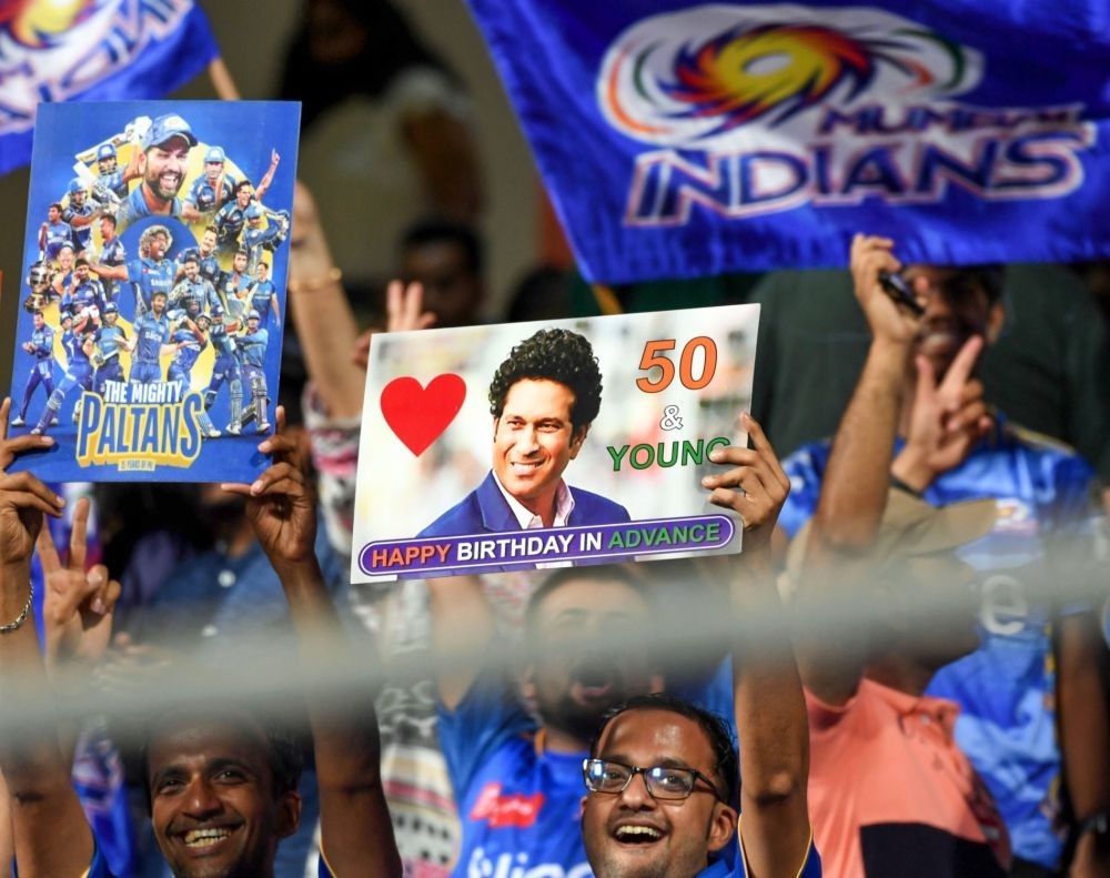 Mumbai : Mumbai Indians fans cheer for their team during the IPL 2023 match between Mumbai Indians and Punjab Super Kings at Wankhede Stadium in Mumbai on Saturday on April 22, 2023. (Photo:IANS)