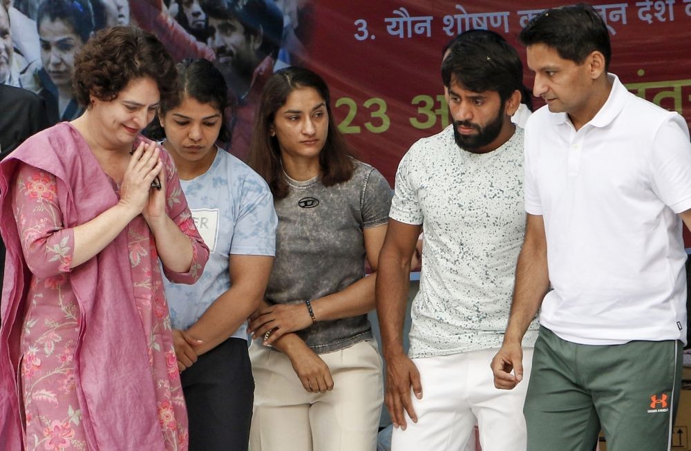New Delhi: Congress leader Priyanka Gandhi with wrestlers Bajrang Punia, Vinesh Phogat, Sakshi Malik and Sangita Phogat during their protest at Jantar Mantar in New Delhi on Saturday, April 29, 2023. (Photo: IANS/Wasim Sarvar)