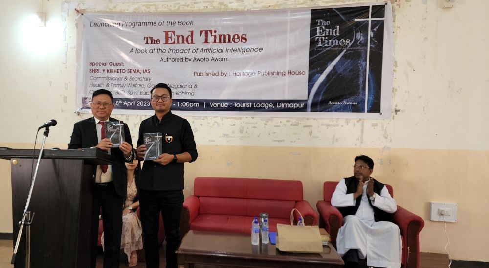 Y Kikheto Sema, Commissioner and Secretary, Health and Family Welfare and with the author Awoto Awomi, during the release of Awomi’s book, on April 8, Dimapur. (Morung Photo)