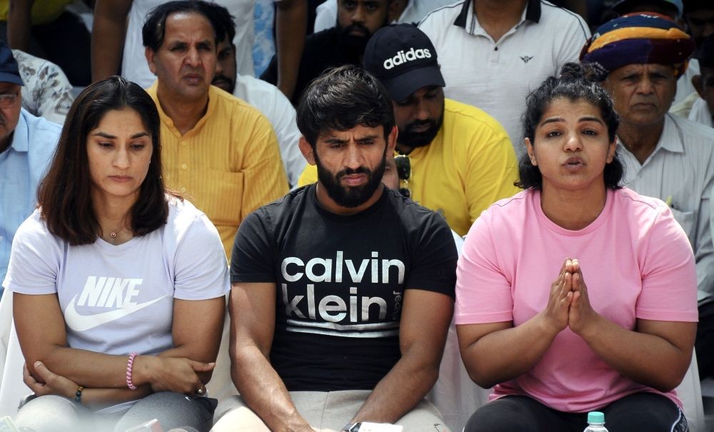 New Delhi: Wrestlers Bajrang Punia, Sakshi Malik and Vinesh Phogat address a press conference during their protest, at Jantar Mantar in New Delhi, on Monday, April 24, 2023.(Photo: Qamar Sibtain/IANS)