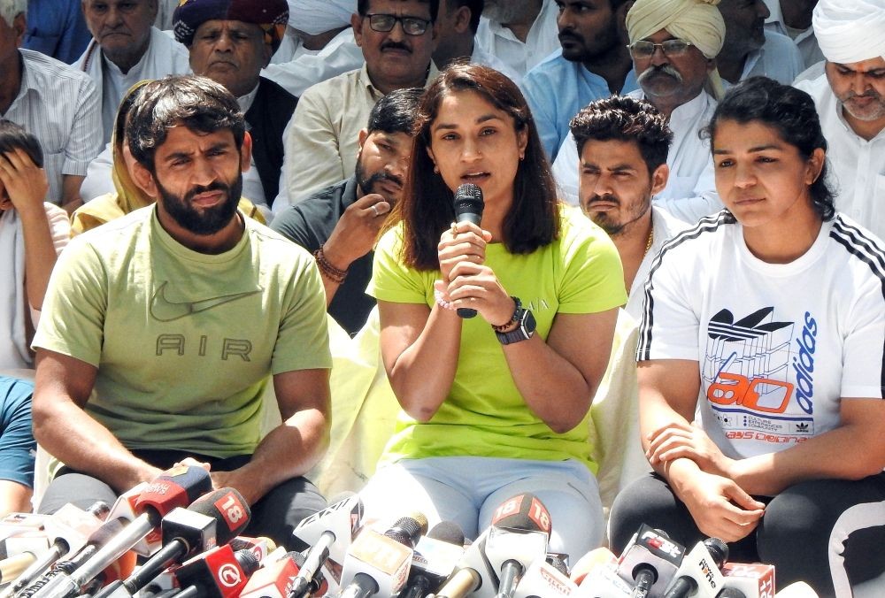 New Delhi: Wrestlers Bajrang Punia, Sakshi Malik and Vinesh Phogat address a press conference during their protest at Jantar Mantar, in New Delhi, Tuesday, April 25, 2023.(Photo:IANS/Anupam Gautam)