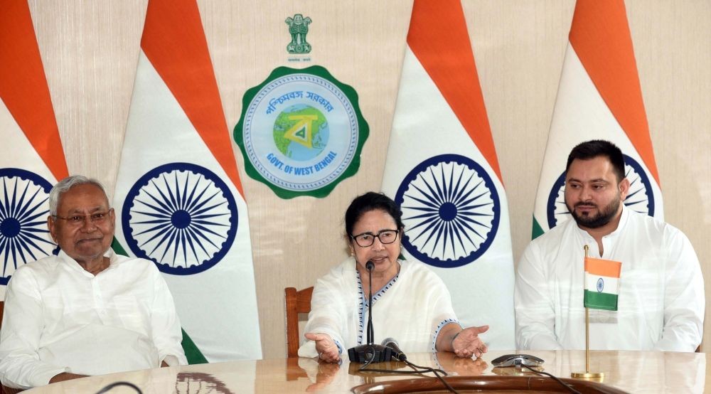Howrah : West Bengal Chief Minister Mamata Banerjee with Bihar Chief Minister Nitish Kumar and Deputy Chief Minister Tejashwi Yadav during a joint press conference after their meeting at Nabanna, in Howrah on Monday, April 24, 2023. (Photo:IANS)