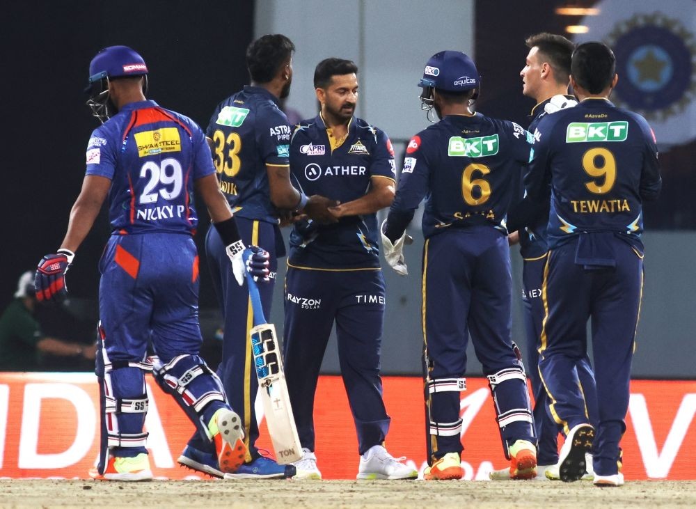 Lucknow : GT players celebrate the dismissal of LSG's Nicholas Pooran during the IPL 2023 match between Lucknow Super Giants and Gujarat Titansat at Ekana Cricket Stadium in Lucknow on Saturday, April 22, 2023. (IANS/Biplab Banerjee)