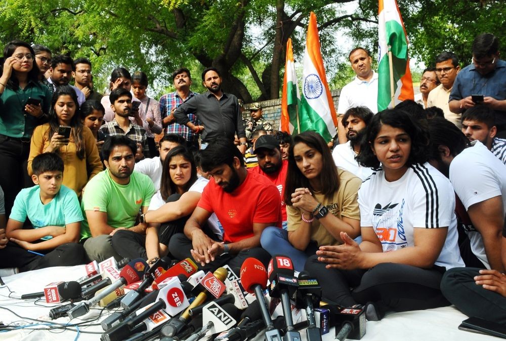 New Delhi: Wrestlers Bajrang Punia, Vinesh Phogat, Sakshi Malik and others at a press conference during their protest at Jantar Mantar in New Delhi, Sunday, April 23, 2023. (Photo:Qamar Sibtain/ IANS)