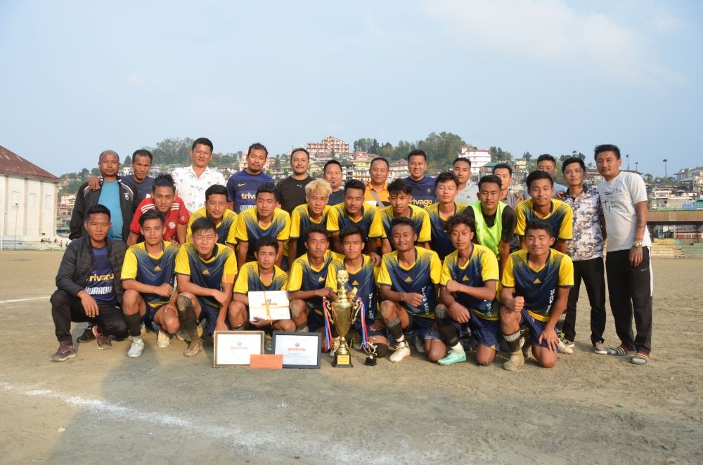 Revenant FC, champion of the 1st U-20 Football Running Trophy, with officials and organizers at Imkongmeren Sports Complex, Mokokchung on April 27. (Morung Photo)