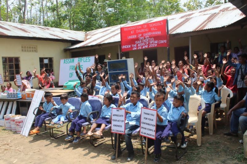 Students of the Zhuikhe primary school along with teachers with the items provided by Assam Rifles, IGAR (North) on April 26. (Photo Credit: PRO Defence )