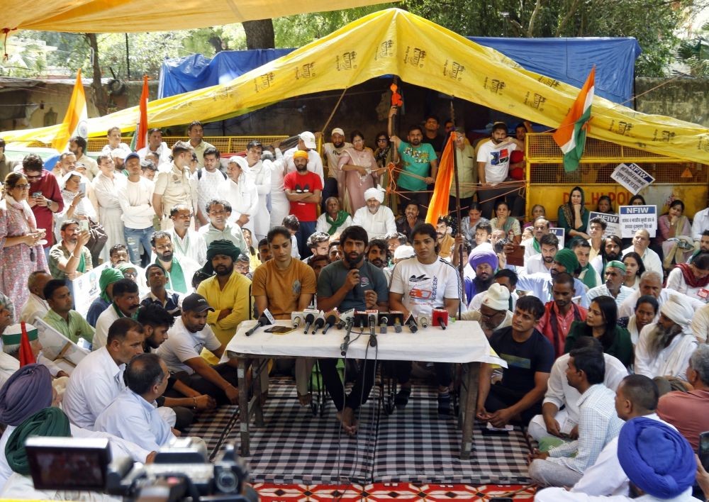 New Delhi: Wrestlers Bajrang Punia, Vinesh Phogat and Sakshi Malik address a press conference during their protest, at Jantar Mantar, in New Delhi,on Wednesday, May 10,2023. (Photo: Wasim Sarvar/IANS)