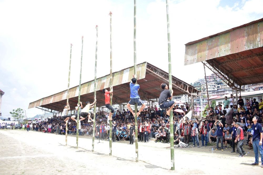 Participants during the pole climbing competition held as part of the Moatsü festival at Imkongmeren Sports Complex on May 1. (Morung Photo)