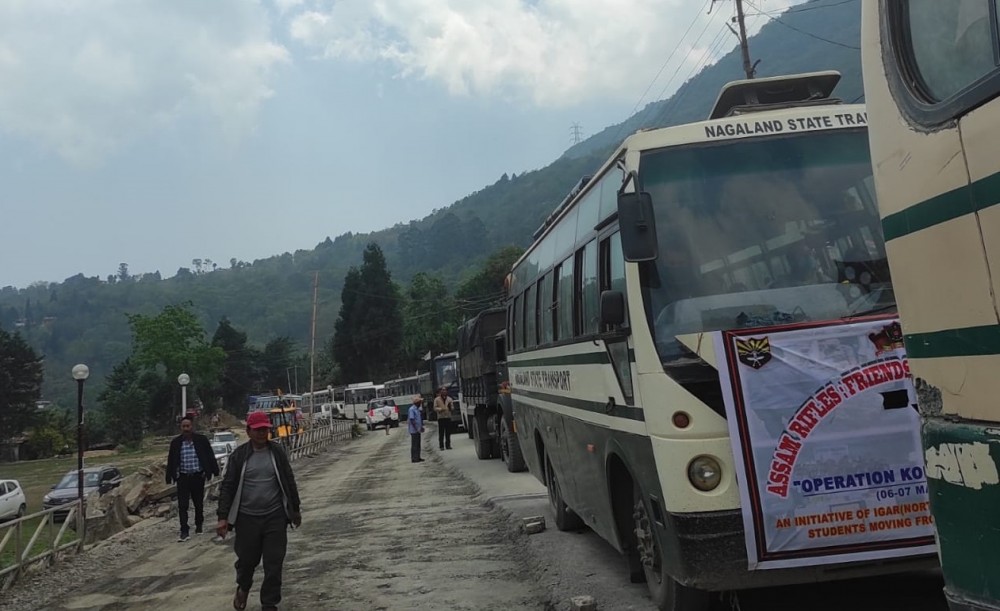 Nagaland State Transport buses and other vehicles carrying evacuees from Manipur arrives in Khuzama, located on the inter-state border with Manipur on May 7.  A total of 676 people from Nagaland stranded in violence-hit Manipur were safely brought to Nagalaand capital Kohima on Sunday in a coordinated operation by Nagaland Government, Assam Rifles and Nagaland Police. (Morung Photo)