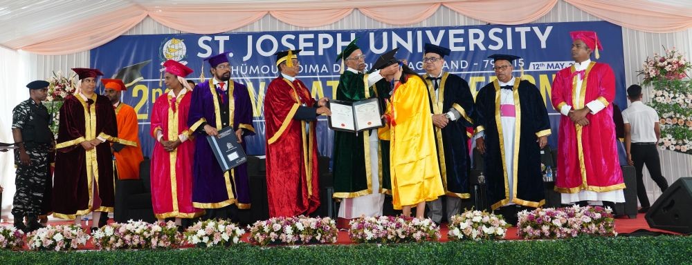 Governor La Ganesan presenting the award to the graduates during the 2nd Convocation of St Joseph University, Chümoukedima which was held on May 12. (Morung Photo)