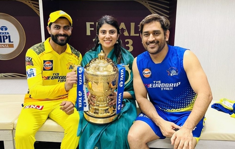 Ahmedabad: Chennai Super Kings captain MS Dhoni, teammate Ravindra Jadeja and his wife Rivaba Jadeja pose for photos with the trophy after Chennai Super Kings won the Indian Premier League (IPL) 2023 final cricket match against Gujarat Titans, in Ahmedabad. (Photo:IANS/Twitter)