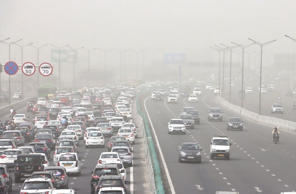 New Delhi: Vehicles ply on the road as the air quality deteriorates due to dust pollution, in New Delhi, Tuesday morning, May 16, 2023. (Photo: Wasim Sarvar/IANS)
