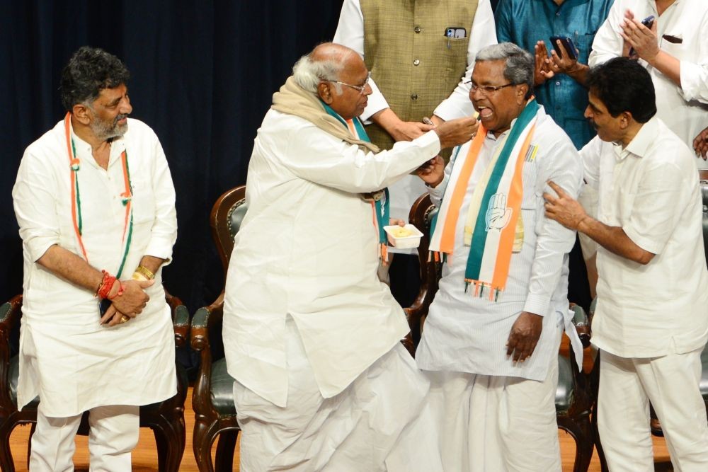 Bengaluru: Congress President Mallikarjun Kharge with senior party leaders Siddaramaiah, D.K. Shivakumar and K.C. Venugopal during celebrations after the party's win in Karnataka Assembly elections, in Bengaluru, Saturday, May 13, 2023. (Photo:  Dhananjay Yadav/IANS)