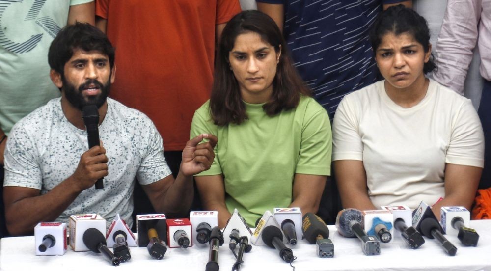 New Delhi: Wrestlers Bajrang Punia, Vinesh Phogat and Sakshi Malik speak to the media during their protest at Jantar Mantar, in New Delhi, on Tuesday, May 2, 2023. (Photo: Wasim Sarvar/IANS)