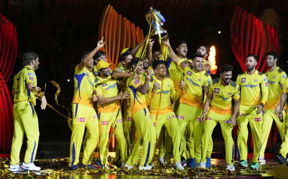 Ahmedabad :Players of Chennai Super Kings celebrate with the winners trophy after their win in the IPL 2023 final match against Gujarat Titans at the Narendra Modi Stadium in Ahmedabad on Tuesday, May 30, 2023. (Photo: IANS/Siddharaj Solanki)