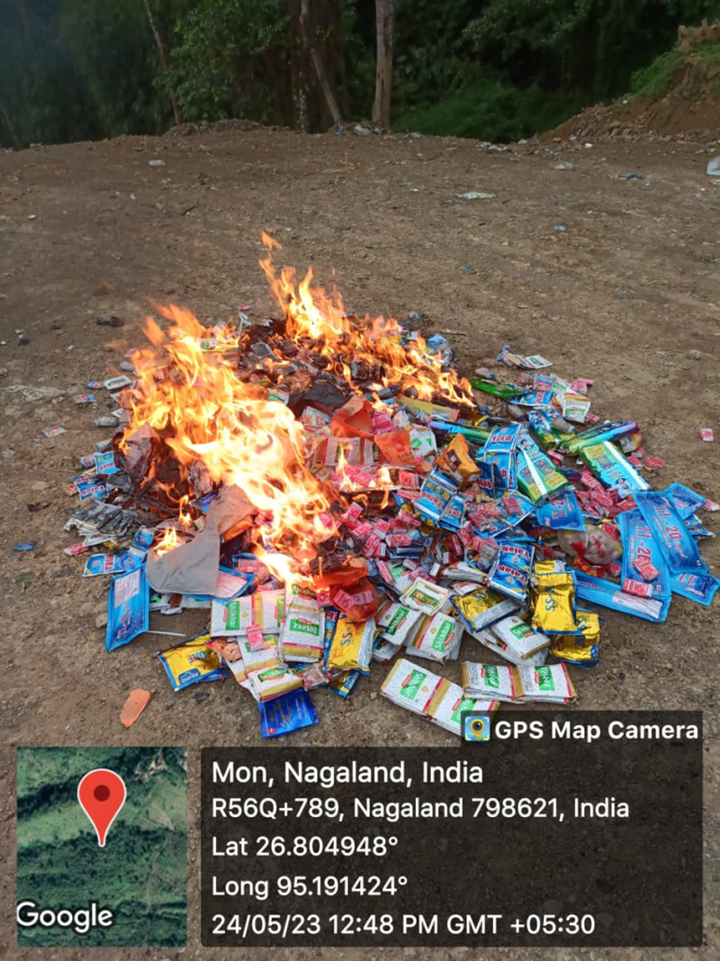 Destroying the tobacco products which was seized during the enforcement drive carried out by the enforcement squad under National Tobacco Control Programme Mon on May 24 at Mon Town. (Photo Courtesy: DIPR)
