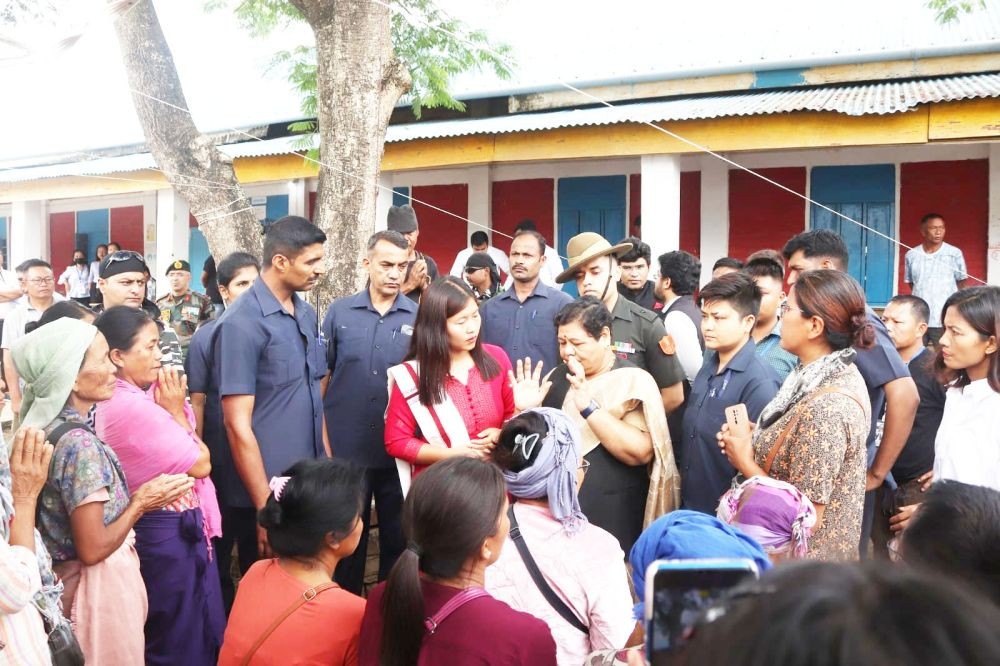 Governor of Manipur Anusuiya Uikey interacts with violence affected people during her visit to different relief centres in Bishnupur  and Churachandpur districts on June 13. (Photo:IANS/Twitter)