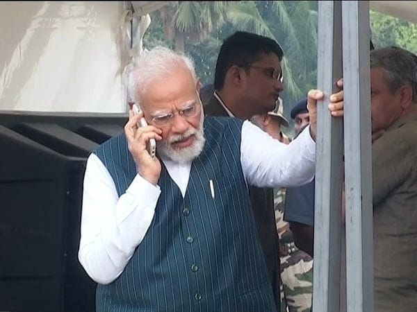 Balasore: Prime Minister Narendra Modi talks on mobile phone as he visits the train accident site in Balasore district, Saturday, June 3, 2023. (Photo:IANS/Twitter)