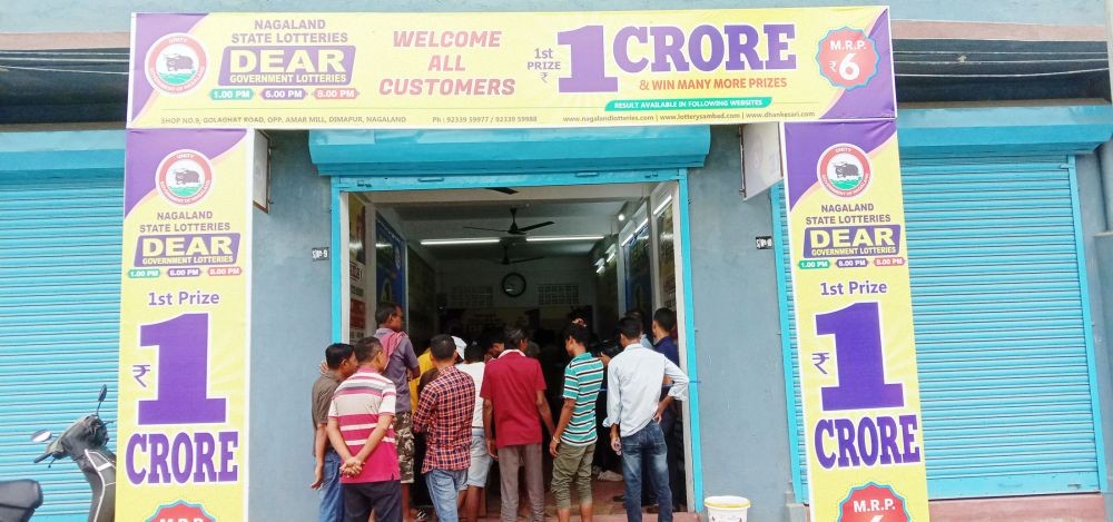Inquisitive onlookers and buyers throng the Nagaland State Lottery’s ‘Dear Lottery’ outlet located at Golaghat Road on June 12. (Morung Photo)