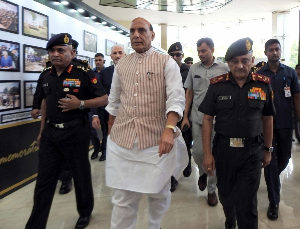 New Delhi: Defence Minister Rajnath Singh with Chief of Army Staff General Manoj Pande, and Chief of Defence Staff of the Indian Armed Forces Anil Chauhan visit an exhibition at the 75th anniversary event of 'UN Peacekeepers Day', in New Delhi, Tuesday, June 13, 2023. (Photo:IANS/Anupam Gautam)