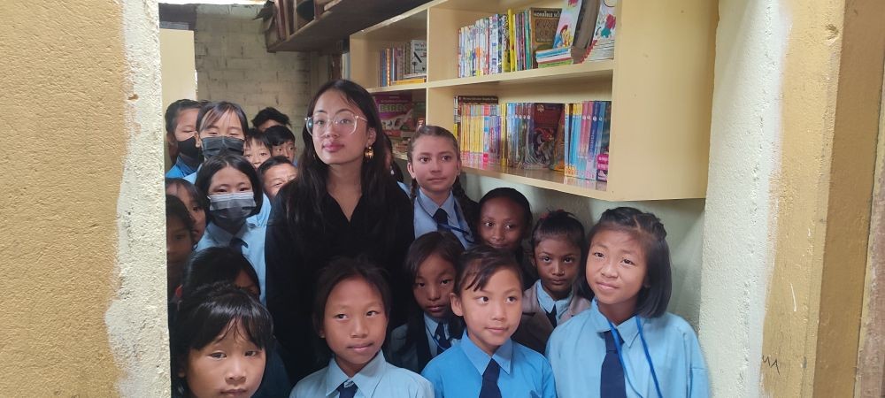 Adora Kikon with students of GPS High School Area, Ward No. 1, Kohima. A Mini Library at the GPS was initiated by her to help students discover the joy of reading and empower them with knowledge. (Morung Photo)