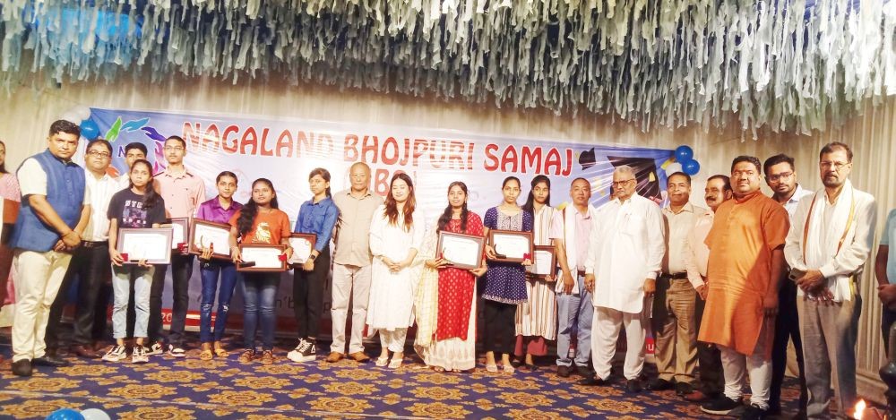 Mayang Lima, Upa-Lokayukta, Nagaland with the Bhojpuri community members and the meritorious students at the programme on June 18. (Morung Photo)