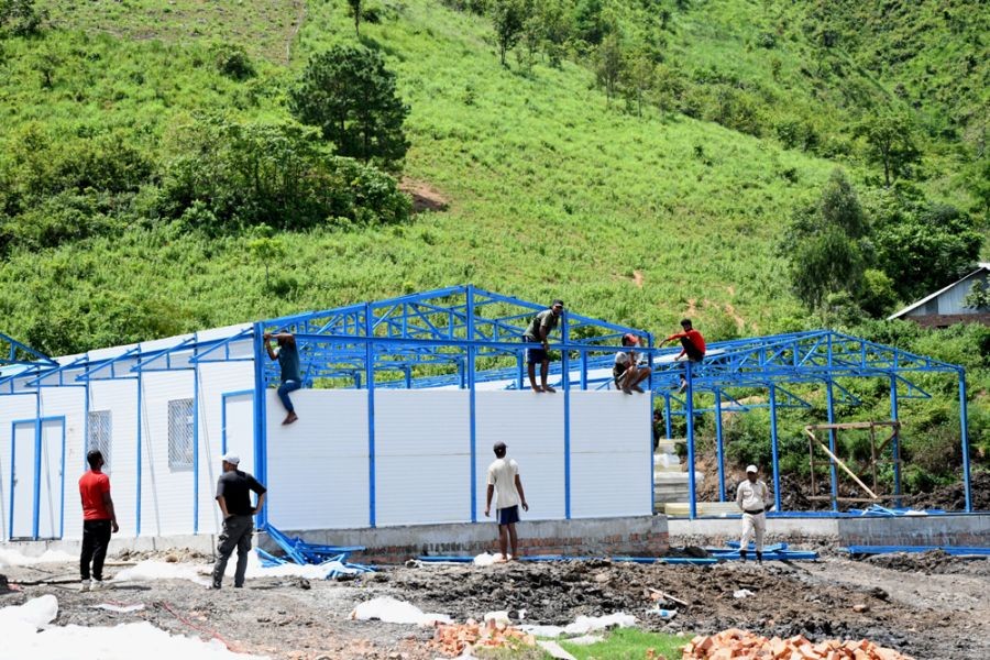 Fabricated shelter houses for displaced people under construction in Manipur. (NNN Photo)