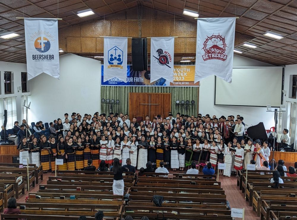 Youth members singing theme song ‘Niepu Kekhrie’ during the morning devotional service at CBCMHK on July 2.