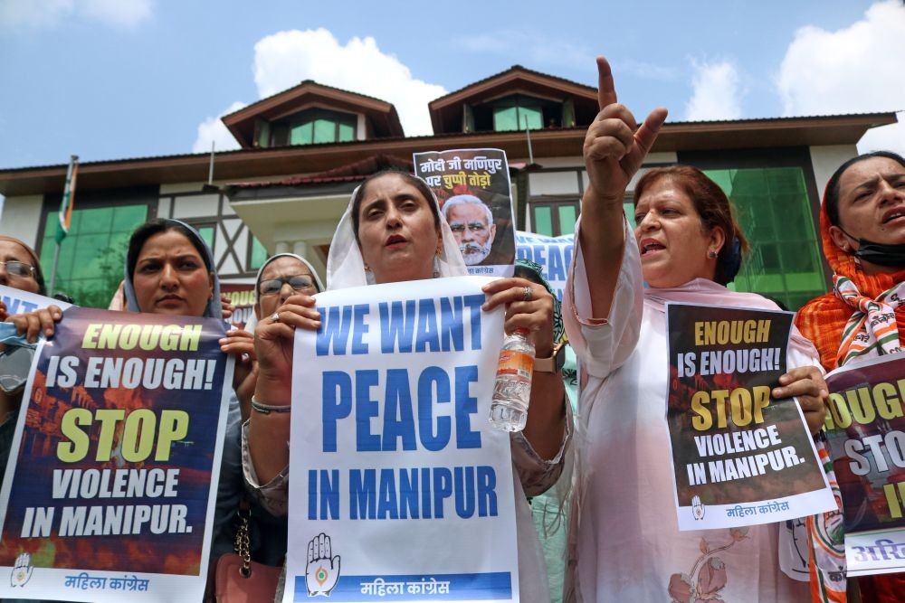 Srinagar: Members of Jammu and Kashmir Pradesh Congress Committee (JKPCC) women's wing hold placards and stage a protest over the ethnic violence in Manipur, in Srinagar on Monday, July 24, 2023. (Photo: IANS/Nisar Malik)