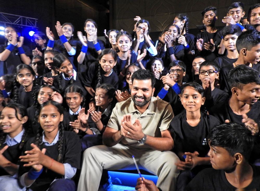 Gurugram : Indian cricketer Rohit Sharma interacts with children during an awareness program on vision care in Gurugram on Friday, August 18, 2023. (Photo:IANS/Anupam Gautam)