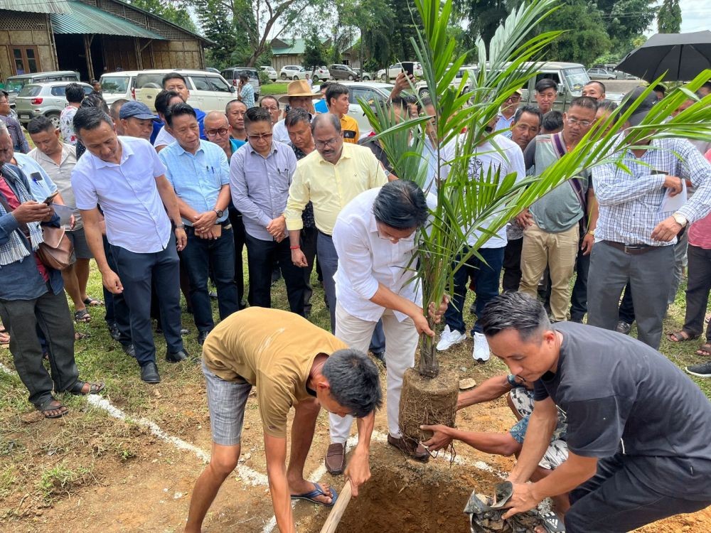 Advisor of Agriculture Mhathung Yanthan planting a sapling during the Nagaland mega oil palm plantation drive at Angh House, Agri Expo, Chumoukedima on August 4. (Morung Photo)